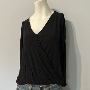 Cute black cross over top, size S. Gathered waste in front & loose in the back.
